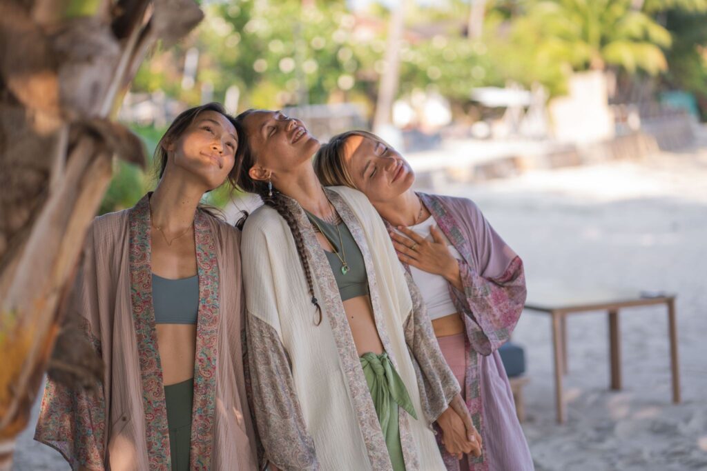 Three women modeling Sisters of Siam kimonos